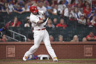 St. Louis Cardinals' Yadier Molina hits a single to drive in the winning run during the 10th inning of the team's baseball game against the Chicago Cubs on Wednesday, July 21, 2021, in St. Louis. (AP Photo/Joe Puetz)