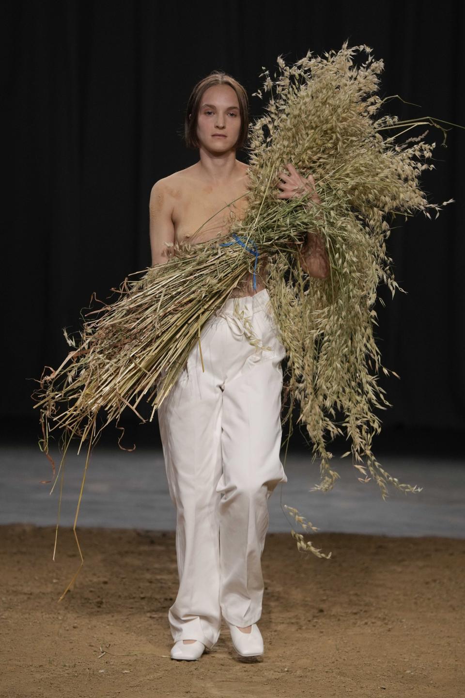 A model wears a creation as part of the Federico Cina men's Spring Summer 2024 collection presented in Milan, Italy, Saturday, June 17, 2023. (AP Photo/Luca Bruno)