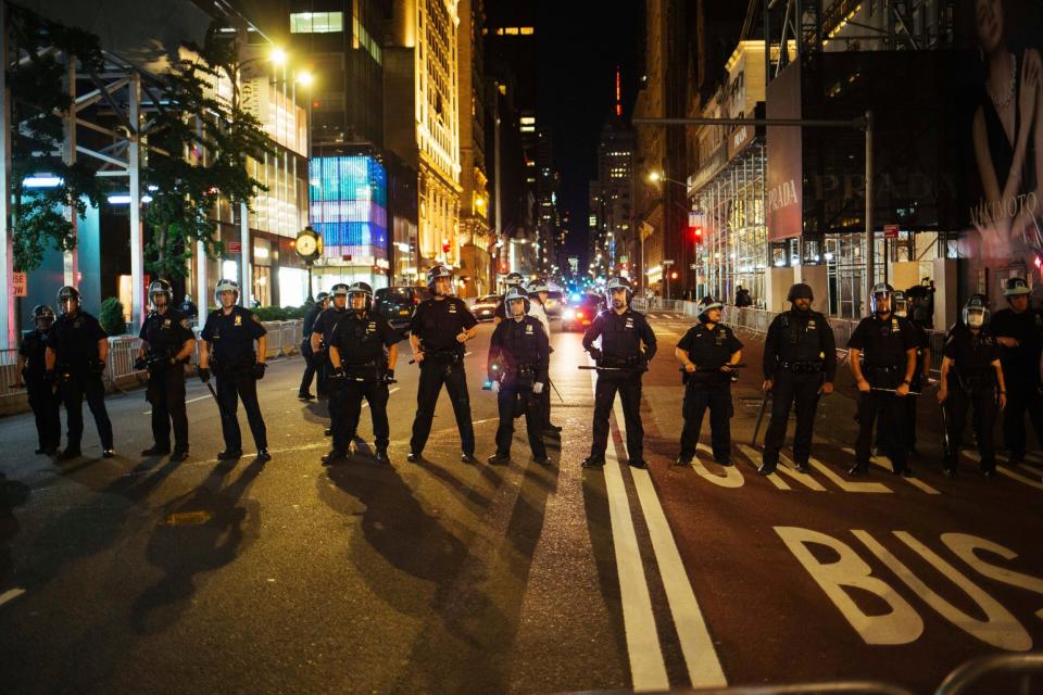 Police form a line on Fifth Avenue outside Trump Tower on Sunday, May 31, 2020, in New York (AP)