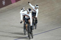 Team Germany celebrates during a qualifying heat for track cycling women's team pursuit at the 2020 Summer Olympics, Monday, Aug. 2, 2021, in Izu, Japan. (AP Photo/Christophe Ena)