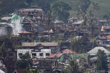 Smoke is seen while Philippines army troops continue their assault against insurgents from the Maute group in Marawi City, Philippines June 28, 2017. REUTERS/Jorge Silva