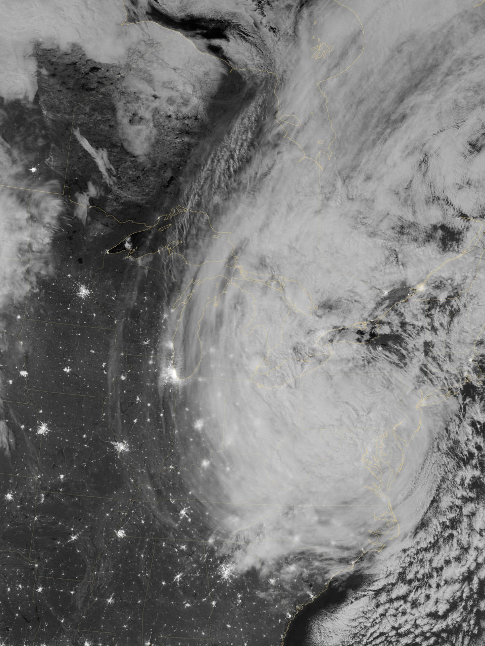 The Visible Infrared Imaging Radiometer Suite (VIIRS) on the Suomi NPP satellite acquired this image of Hurricane Sandy around 3:35 a.m. Eastern Daylight Time (7:35 Universal Time) on October 30. This image is from the “day-night band” on VIIRS, which detects light wavelengths from green to near-infrared. The full Moon, which exacerbated the height of the storm water surge, lit the tops of the clouds. (NASA)