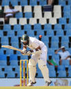 South Africa's batsman Hashim Amla, is struck by a bounce on the second day of their their cricket Test match against Australia at Centurion Park in Pretoria, South Africa, Thursday, Feb. 13, 2014. (AP Photo/ Themba Hadebe)