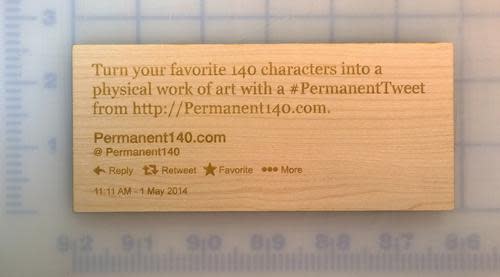Tweet etched into block of wood