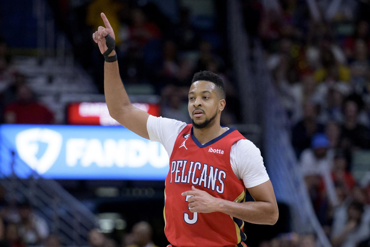 New Orleans Pelicans guard CJ McCollum celebrates a basket against the Sacramento Kings during the first half of an NBA basketball game in New Orleans, Tuesday, April 4, 2023. (AP Photo/Matthew Hinton)