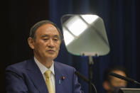 Japan's Prime Minister Yoshihide Suga speaks during a press conference at his official residence in Tokyo, Thursday, July 8, 2021. Suga declared the fourth state of emergency would go in effect on Monday and last through Aug. 22. This means the Olympics, opening on July 23 and running through Aug. 8, will be held entirely under emergency measures. (Nicolas Datiche/Pool Photo via AP)