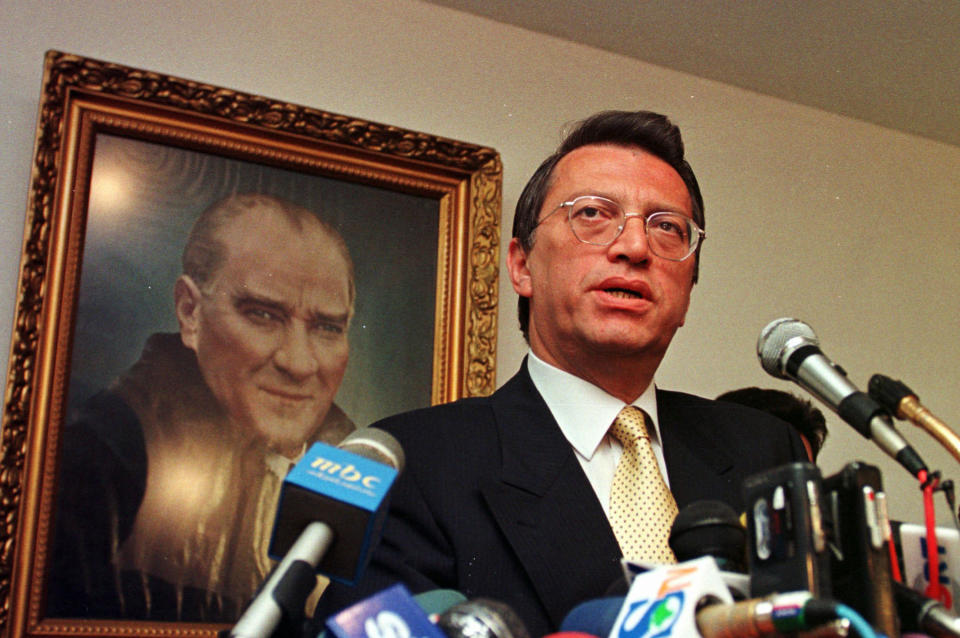 FILE - In this Thursday, June 19, 1997 file photo, Turkish politician Mesut Yilmaz, then main opposition leader and head of Turkey's conservative Motherland Party, speaks to journalists after a meeting in Ankara, Turkey. Yilmaz, a former Turkish prime minister and veteran politician who served as premier three times during a tumultuous political era in his country, died Friday, Oct. 30, 2020, at age 72, official Anadolu news agency said. (AP Photo/Burhan Ozbilici, File)