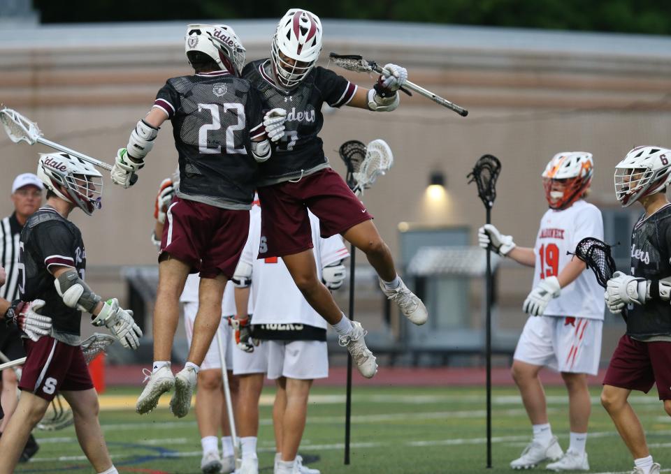 Scarsdale's Nathan Seslowe (22) and Noah Chappell (11) celebrate a first half goal against Mamaroneck during the Section 1 Class A championship game at Lakeland High School in Shrub Oak May 27, 2022. Scarsdale won the game 12-7.