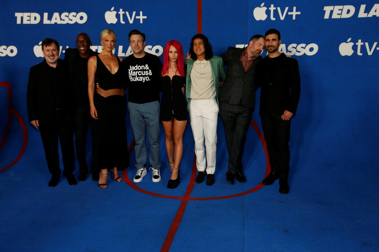 Cast members Jeremy Swift, Moe Jeudy-Lamour, Hannah Waddingham, Jason Sudeikis, Juno Temple, Cristo Fernandez, Brendan Hunt, and Brett Goldstein attend the premiere for season two of the television series 