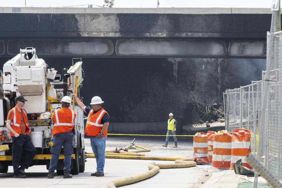 Officials work on the scene following a collapse on I-95 after a truck fire, Sunday, June 11, 2023 in Philadelphia. (AP Photo/Joe Lamberti)