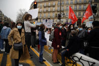 Students gather during a protest in Paris, Tuesday Jan.26, 2021. Schoolteachers and university students marched together in protests or went on strike Tuesday around France to demand more government support amid the pandemic. (AP Photo/Christophe Ena)