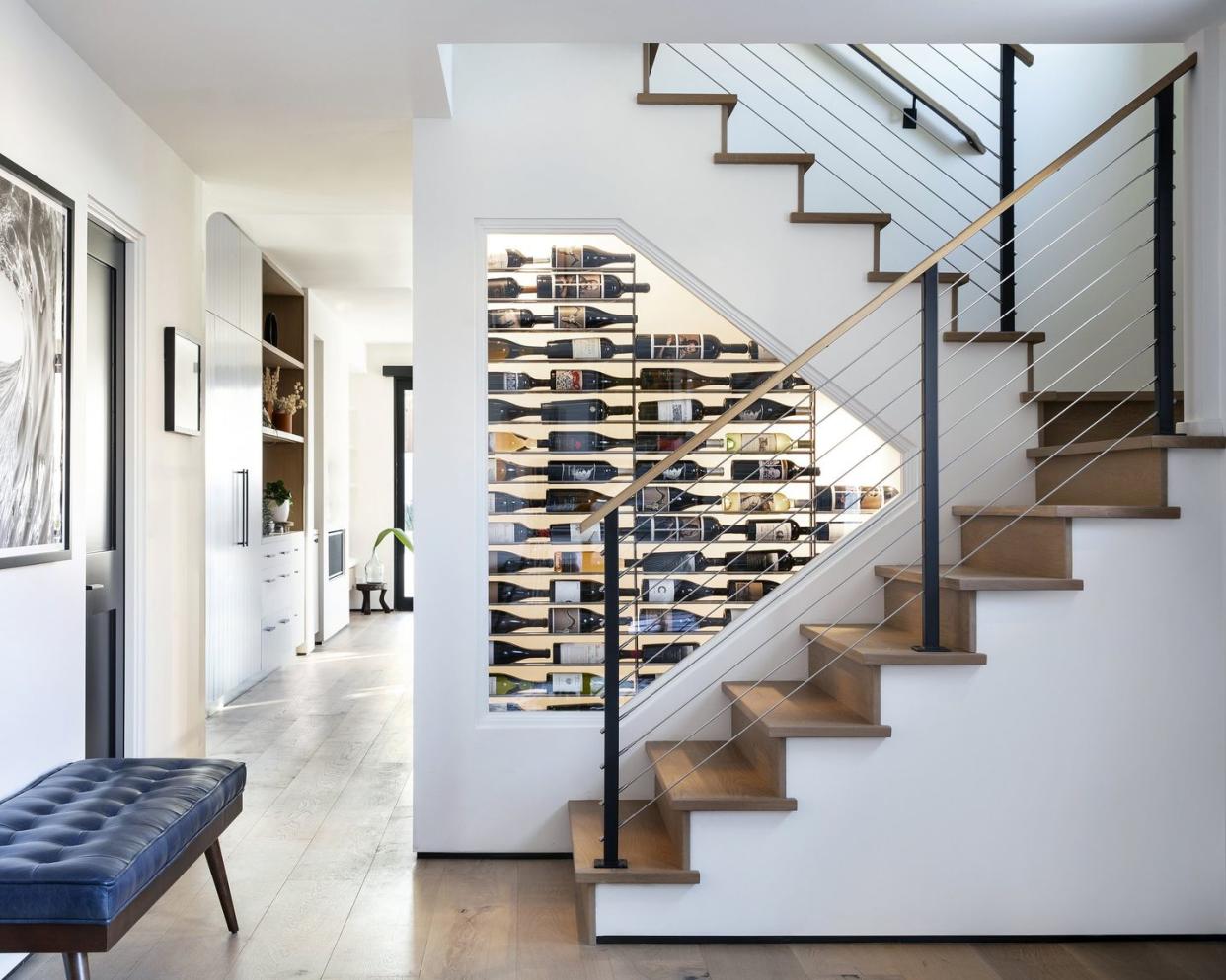 a staircase with a wine rack