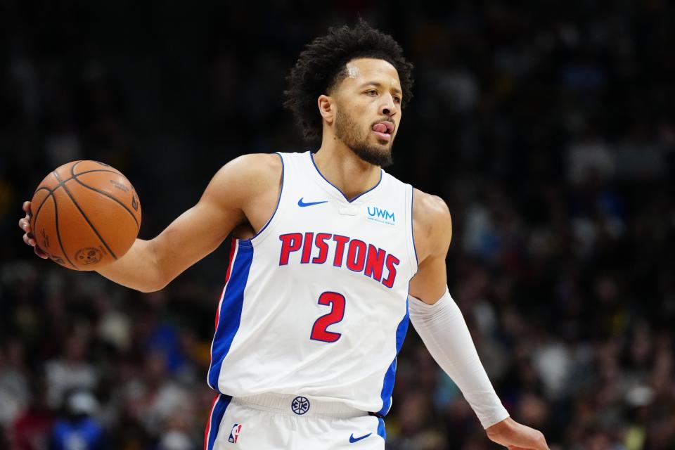 Detroit Pistons guard Cade Cunningham (2) controls the ball during the first quarter against the Denver Nuggets at Ball Arena in Denver on Sunday, Jan. 7, 2024.