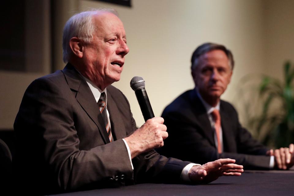 Former Democratic Gov. Phil Bredesen, left, answers a question during a discussion on bipartisanship at Vanderbilt University Tuesday, Nov. 5, 2019, in Nashville, Tenn. At right is former Republican Gov. Bill Haslam. (AP Photo/Mark Humphrey)