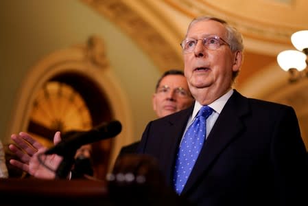 Senate Majority Leader Mitch McConnell speaks with reporters following the weekly policy luncheons on Capitol Hill