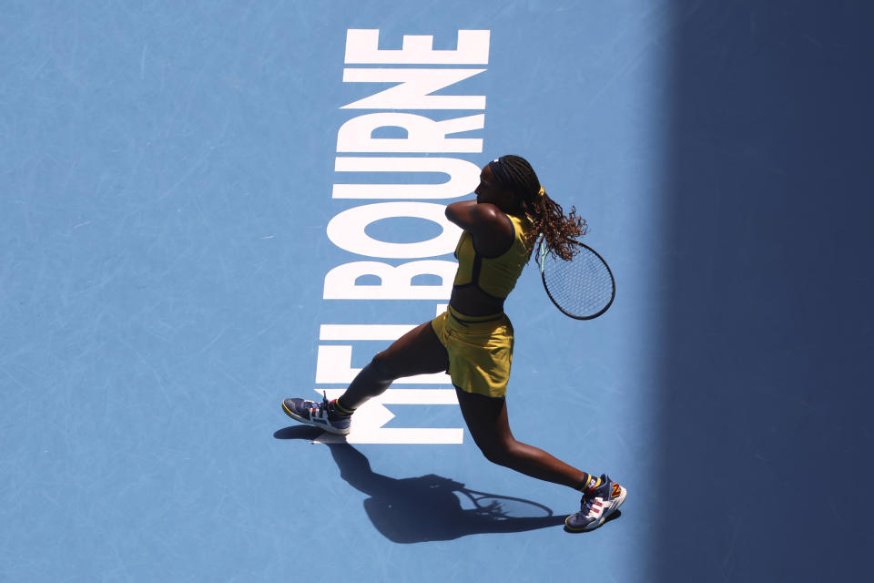 Coco Gauff of the U.S. plays a backhand return to Marta Kostyuk of Ukraine during their quarterfinal match at the Australian Open tennis championships at Melbourne Park, Melbourne, Australia, Tuesday, Jan. 23, 2024. (AP Photo/Asanka Brendon Ratnayake)