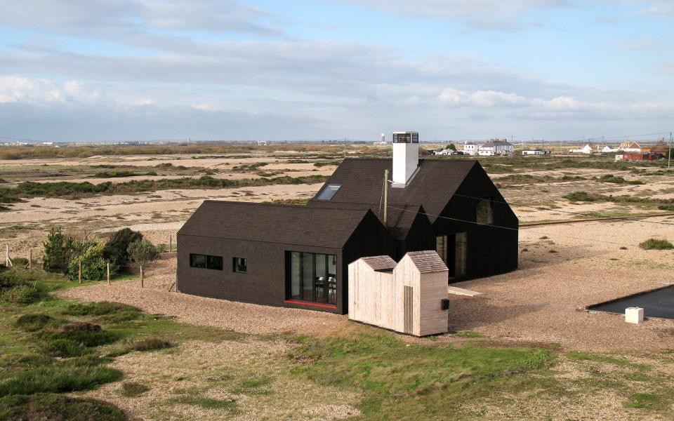 The NORD Architecture-designed Shingle House is a striking pitch-black