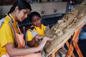 Student artists at Christel House India - Bangalore create a sculpture.