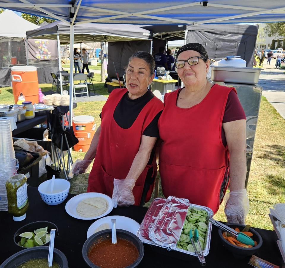 Maria Magama assists her friend Margarita Rodriguez of Margarita's Tacos, a brand new vendor at the Hesperia Community Farmers Market.