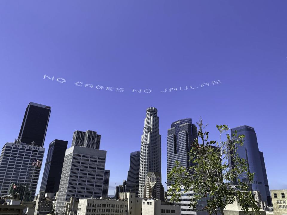 "No cages no jaulas," a message created by L.A. artist Beatriz Cortez over downtown L.A. on July 3rd.