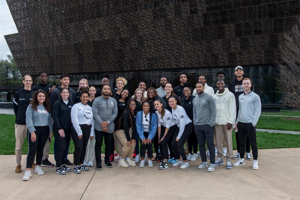 Jr. NBA Court Of Leaders members in front of the National Museum of African American History and Culture.