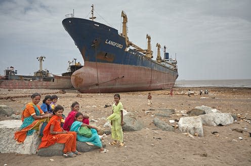 <span class="caption">A large cargo ship waiting to be scrapped in Alang, India.</span> <span class="attribution"><span class="source">Salvacampillo / shutterstock</span></span>