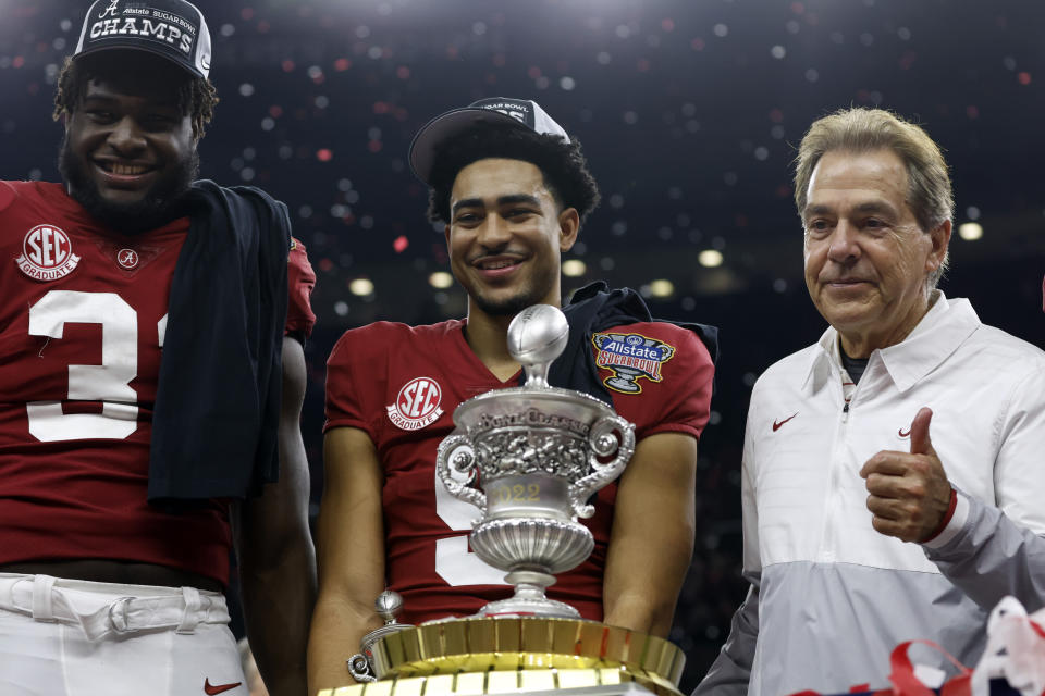 Alabama linebacker Will Anderson Jr., left, quarterback Bryce Young, center, and head coach Nick Saban, right, stand with the trophy as they celebrate after the Sugar Bowl NCAA college football game where Alabama defeated Kansas State 45-20 Saturday, Dec. 31, 2022, in New Orleans. (AP Photo/Butch Dill)