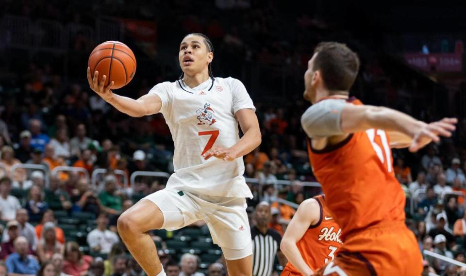 Miami Hurricanes guard Kyshawn George (7) goes to score as Virginia Tech Hokies forward Robbie Beran (31) defends during the second half of their NCAA basketball game at the Watsco Center on Saturday, Feb. 3, 2024, in Coral Gables, Fla.