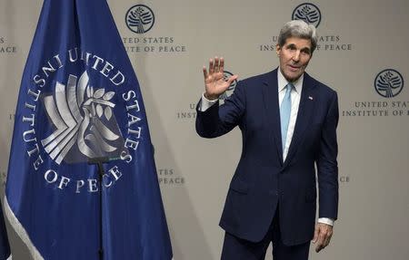 U.S. Secretary of State John Kerry waves after delivering remarks on the "U.S. strategy in Syria" at the United States Institute of Peace in Washington November 12, 2015. REUTERS/Joshua Roberts