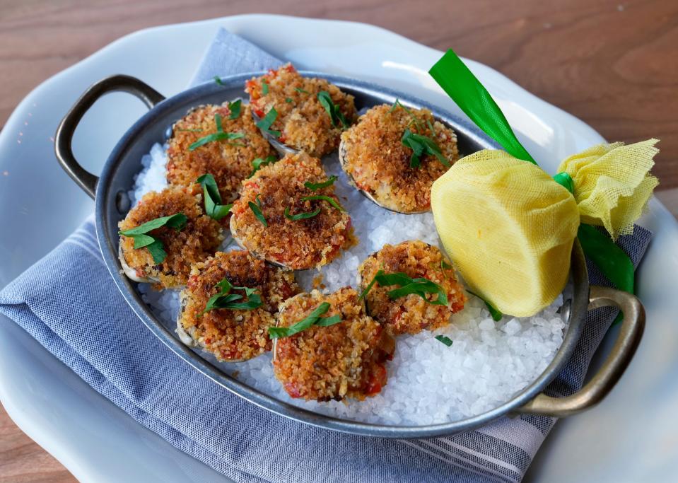 Clams casino with littleneck clams, bacon, Calabrian chili, bread crumbs and Parmigiano-Reggiano.