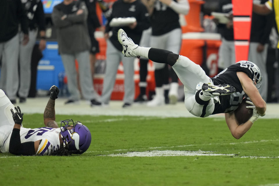 Las Vegas Raiders tight end Jesper Horsted is tackled by Minnesota Vikings cornerback Parry Nickerson during the second half of an NFL preseason football game, Sunday, Aug. 14, 2022, in Las Vegas. (AP Photo/John Locher)