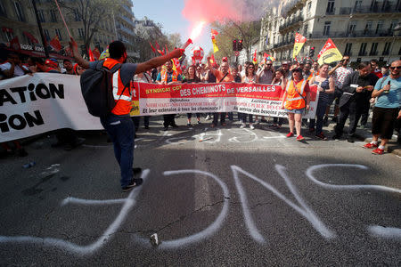 FILE PHOTO: French state-owned railway company SNCF workers attend a demonstration against the French government's reform plans in Paris as part of a national day of protest, France, April 19, 2018. REUTERS/Philippe Wojazer/File Photo