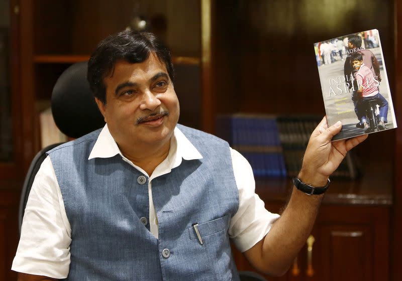 FILE PHOTO: Gadkari displays a book written by him at his office in New Delhi