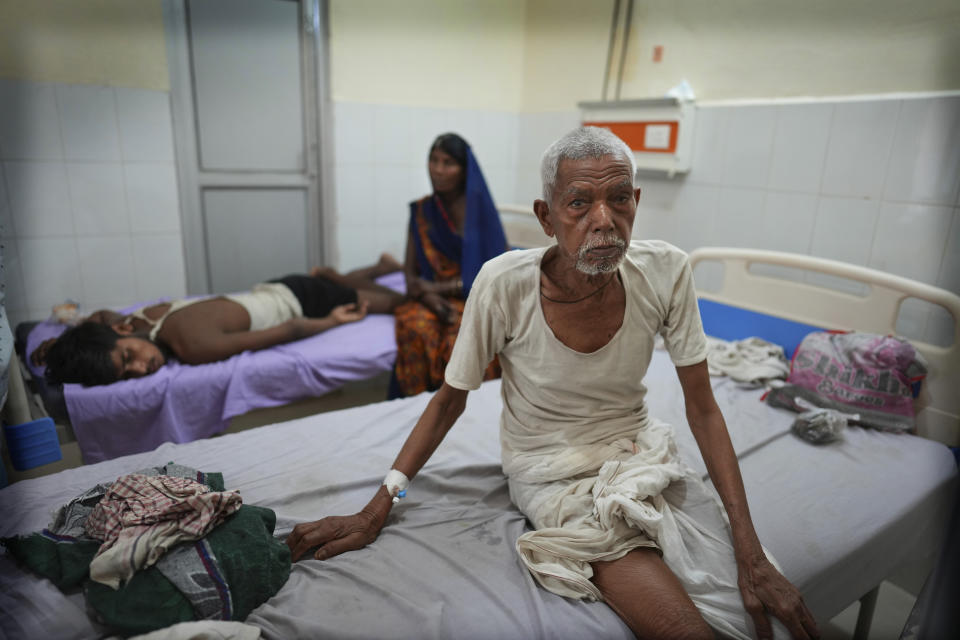 A elderly person recovers at the overcrowded government district hospital in Ballia, Uttar Pradesh state, India, Monday, June 19, 2023. Several people have died in two of India's most populous states in recent days amid a searing heat wave, as hospitals find themselves overwhelmed with patients. More than hundred people in the Uttar Pradesh state, and dozens in neighboring Bihar state have died due to heat-related illness. (AP Photo/Rajesh Kumar Singh)