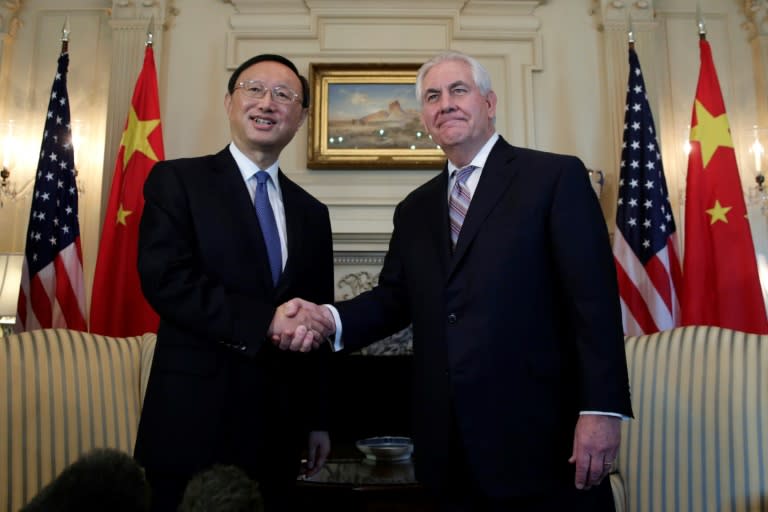 US Secretary of State Rex Tillerson (R) shakes hands with Chinese State Councilor Yang Jiechi before their meeting at the State Department in Washington, DC on February 28, 2017