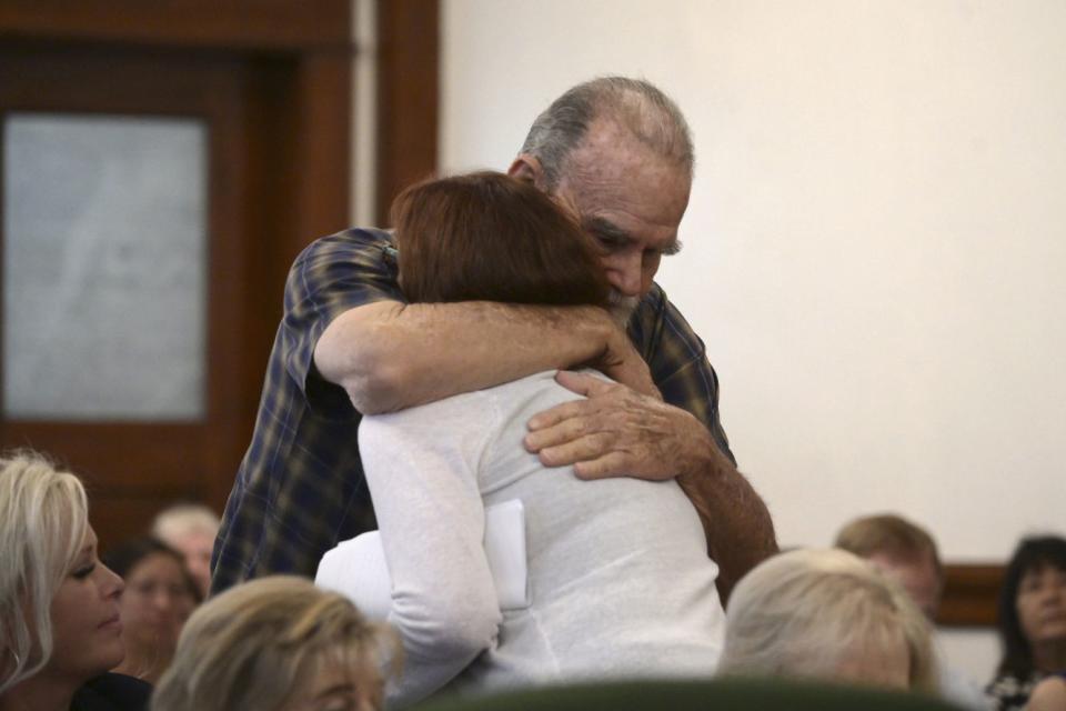 Kay and Larry Woodcock, the grandparents of JJ Vallow, embrace each other during the sentencing hearing of Lori Vallow Daybell at the Fremont County Courthouse in St. Anthony, Idaho.