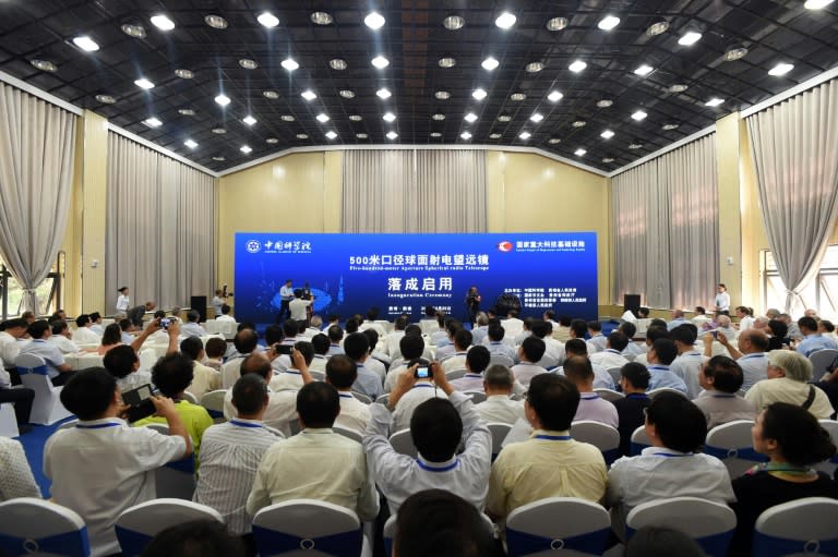 Guests look on during the inauguration ceremony for the Five-hundred-metre Aperture Spherical Radio Telescope (FAST) on its first day of operation in Pingtang, in southwestern China's Guizhou province on September 25, 2016