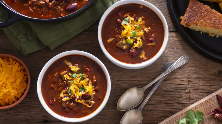 bowls of chili with cheese