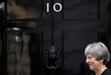 Britain's Prime Minister Theresa May walks out of 10 Downing Street to greet the Prime Minister of Estonia, Juri Ratas in London, January 30, 2018. REUTERS/Toby Melville