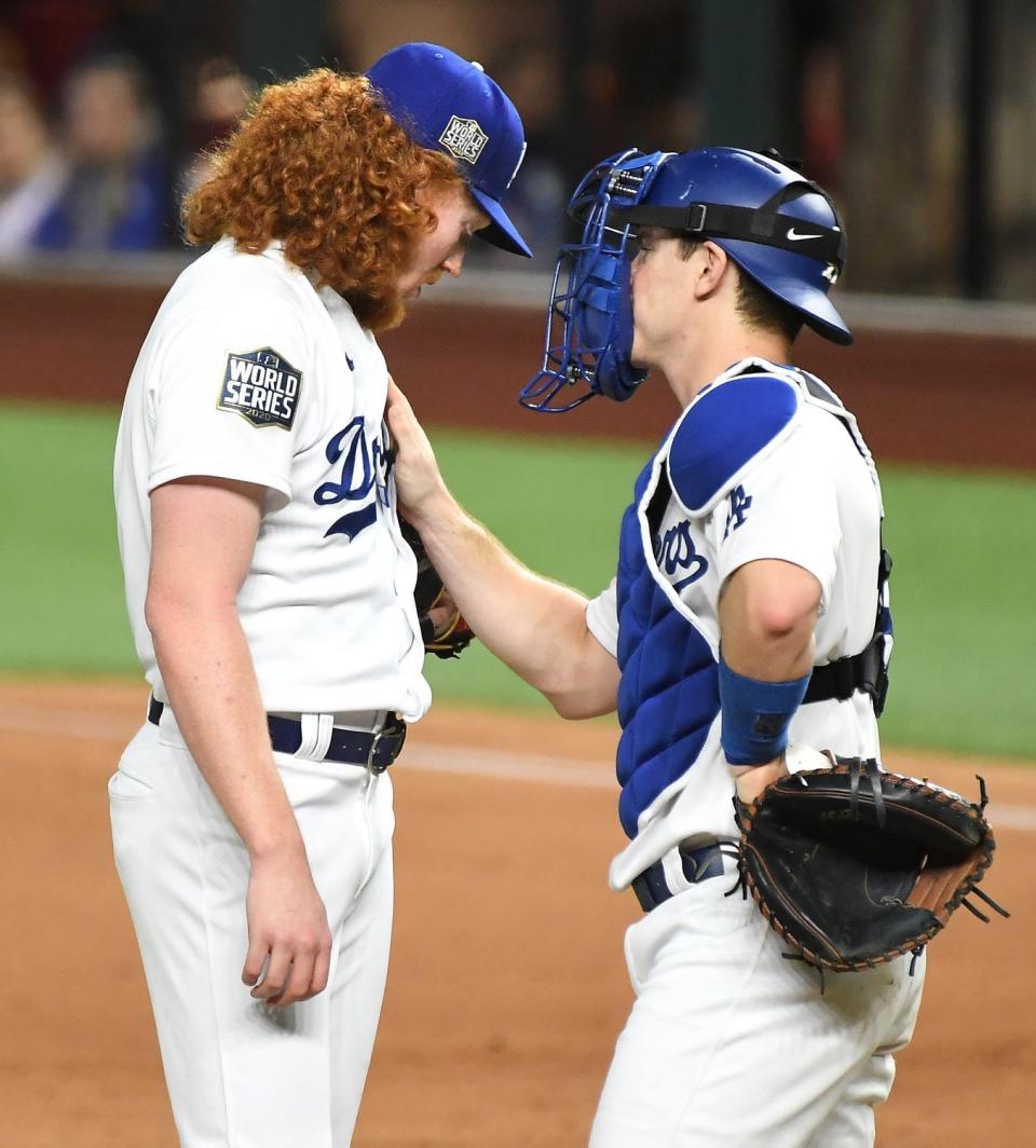 Dodgers pitcher Dustin May speaks with catcher Will Smith after giving up a two-run home run against the Rays.