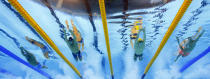 FILE - In this Saturday, Aug. 6, 2016 file photo, Italy's Gabriele Detti, from left, United States' Conor Dwyer, Australia's Mack Horton and China's Sun Yang compete in the final of the men's 400-meter freestyle during the swimming competitions at the 2016 Summer Olympics, in Rio de Janeiro, Brazil. One of China’s biggest Olympic stars will undergo a rare public trial of a doping case on Friday, Nov. 15, 2019 with his 2020 Tokyo Games place at stake. Three-time gold medalist swimmer Sun Yang is facing a World Anti-Doping Agency appeal in Switzerland that seeks to ban him for up eight years. (AP Photo/David J. Phillip, File)