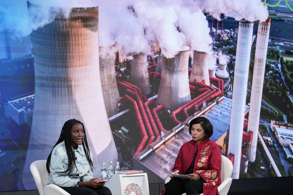Climate activist Vanessa Nakate of Uganda, left, speaks alongside moderator Sabina Bhatia at the 2022 annual meeting of the International Monetary Fund and the World Bank Group, Monday, Oct. 10, 2022, in Washington. (AP Photo/Patrick Semansky)
