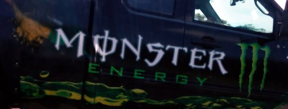 Photo of a truck door emblazoned with the Monster Energy logo.