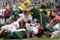 Washington Football Team's Taylor Heinicke is stopped at the goal line on fourth down during the second half of an NFL football game against the Green Bay Packers Sunday, Oct. 24, 2021, in Green Bay, Wis. (AP Photo/Aaron Gash)