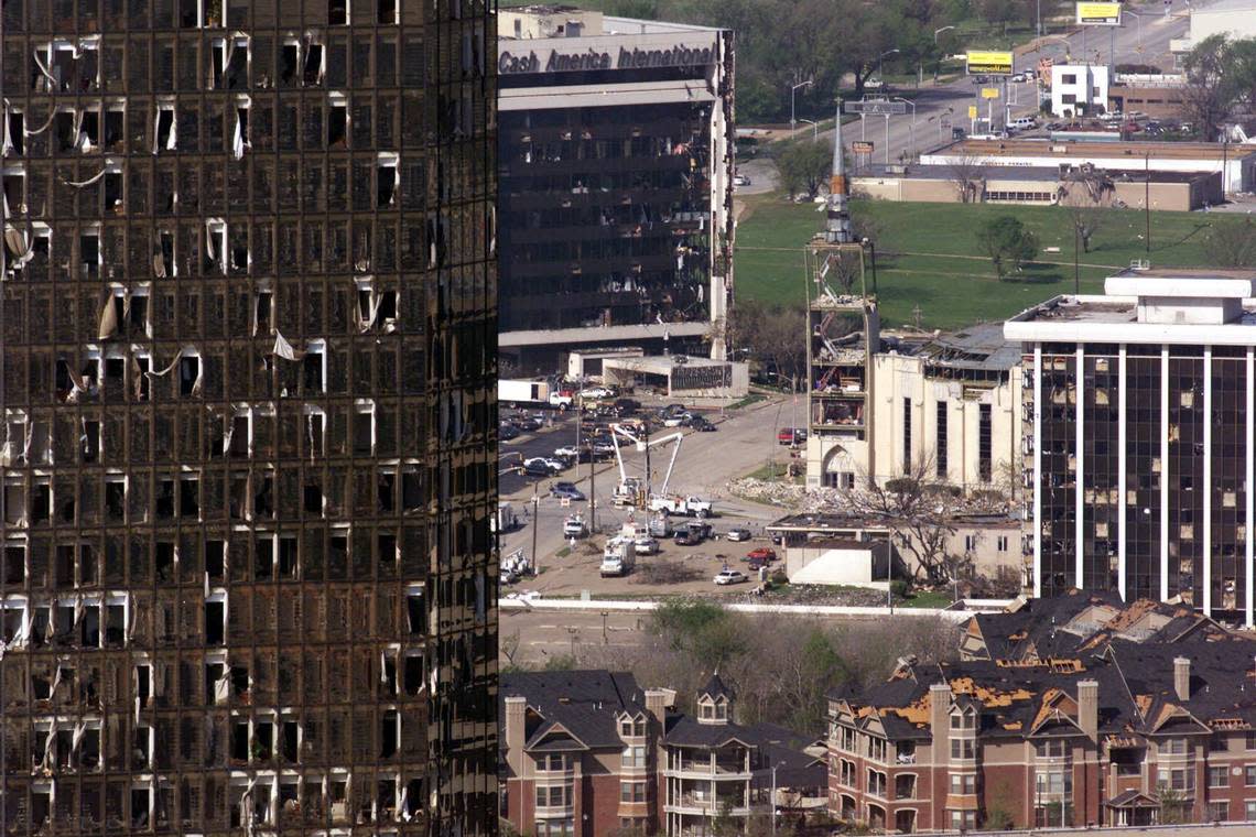 The Bank One Tower, in the foreground looking west, was heavily damaged by the March 28, 2000, tornado. It was rehabilitated and is now The Tower condominiums. In the background are the Cash America International and Calvary Cathedral buildings, and at lower right, Firestone apartments.