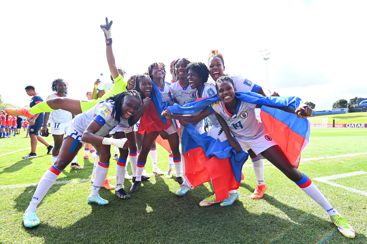AUCKLAND, NEW ZEALAND - FEBRUARY 22: Haiti celebrate qualification for the 2023 FIFA Women's World Cup after their victory in the 2023 FIFA World Cup Play Off Tournament match between Chile and Haiti at North Harbour Stadium on February 22, 2023 in Auckland, New Zealand. (Photo by Hannah Peters - FIFA/FIFA via Getty Images)