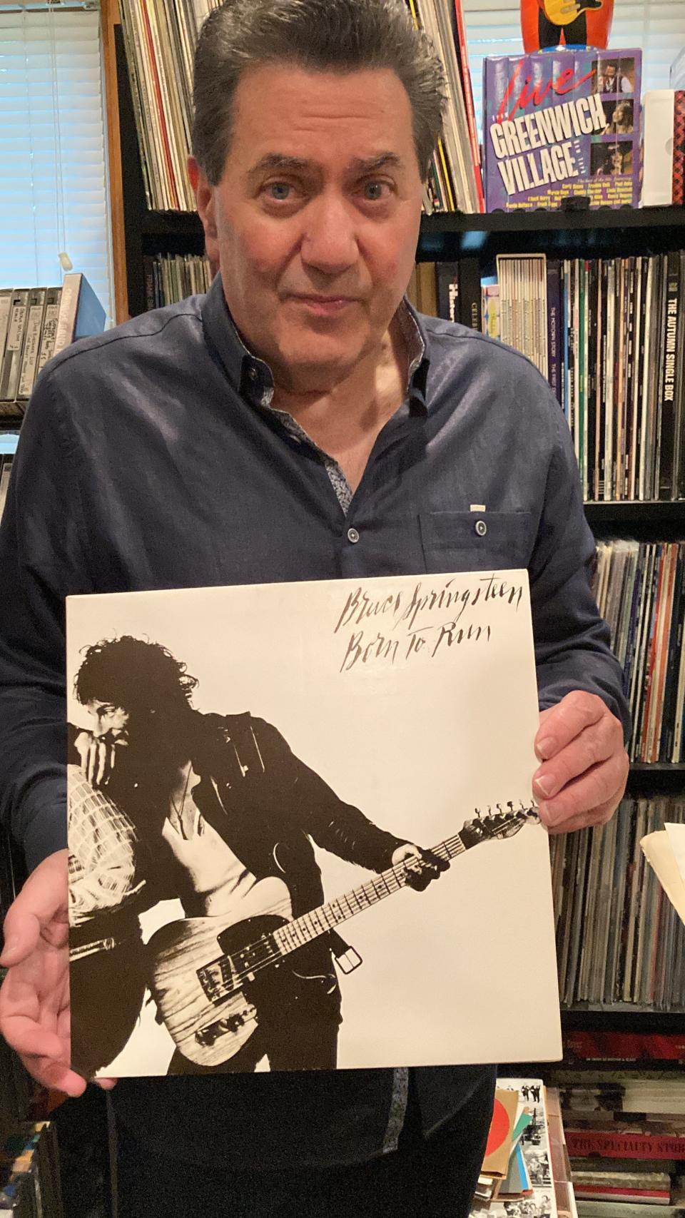 Dave "The Rave" Kapulsky holds the rare "script cover" of Bruce Springsteen's "Born to Run" album.