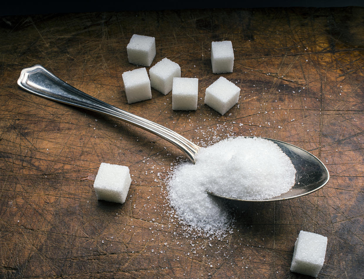 sugar spoon on wood