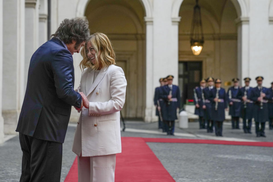 FILE - Italia Premier Giorgia Meloni, right, greets Argentine President Javier Milei as he arrives at Chigi government offices in Rome, Monday, Feb. 12, 2024. Meloni's popularity is expected to ensure significant gains for her far-right Brothers of Italy Party in June's European Parliamentary elections, and European Commission President Ursula Von der Leyen, who has exhibited a liking for Meloni, has already floated the notion of bringing her into a coalition if needed.(AP Photo/Alessandra Tarantino, File)