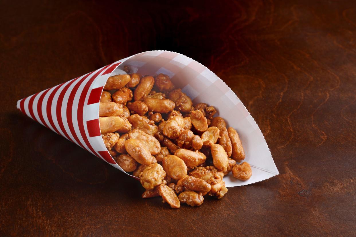 red and white cone with honey covered peanuts